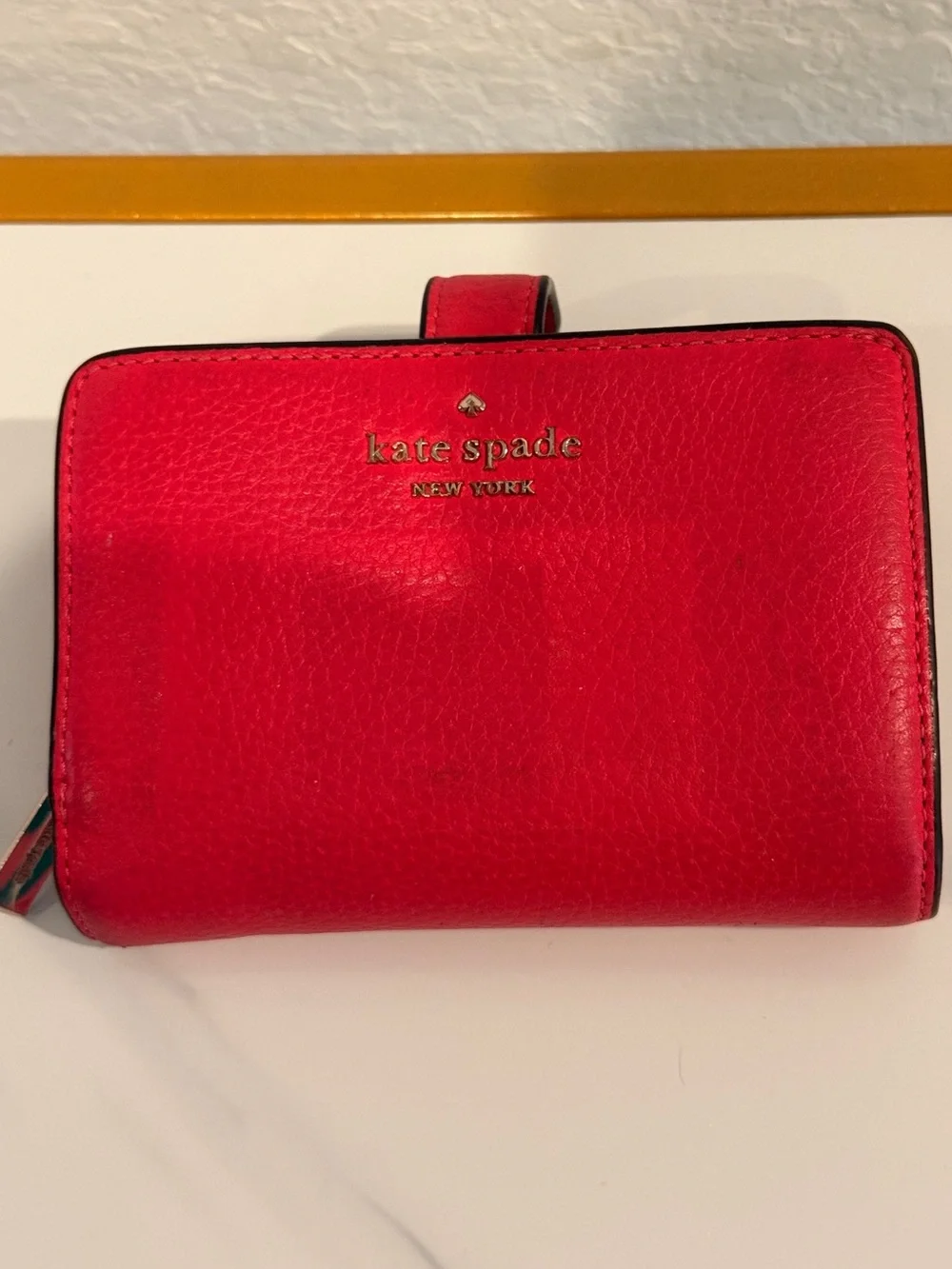 kate spade red pebbled leather snap wallet with gold logo‎